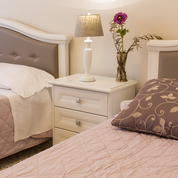 Bedroom with double bed and single bed, detail