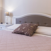 Bedroom with double bed and single bed, detail